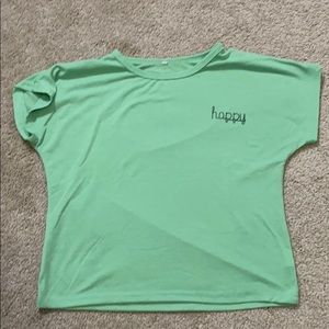 Green T-shirt with “happy” written on it
